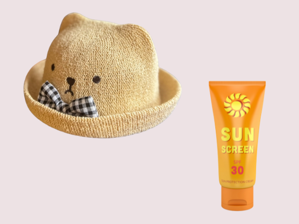 赤ちゃん用帽子と日焼け止めクリーム